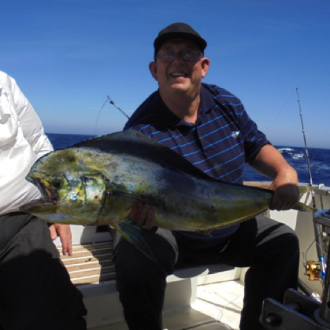 Client with a dourada (dorada) - a female dourado (dorado)